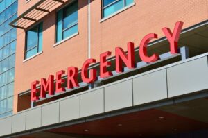 A red emergency sign, signalizing an entrance to the hospital. 