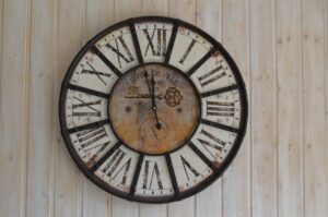 An antique clock on a wall.