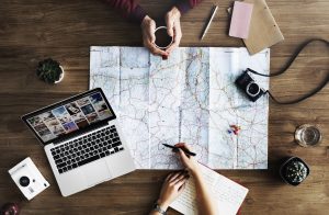 Free personalized moving plan coffe and a map on table while planning to hire local Bergenfield NJ movers