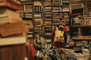 Maybe you can donate some of your old books? A girl in a library