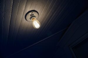 Image of a light bulb coming down from the ceiling