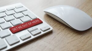 A red button on a white keyboard. 