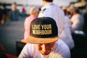 The sense of community that Hackensack offers to its inhabitants is well known Love your neighbor written on a ball cap