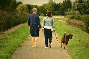 Man and woman walking the dog