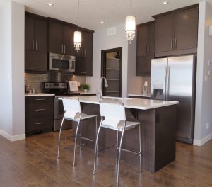 Don’t take any unnecessary risks. Instead, call Moving of America and let us help! A brown kitchen with appliance for appliance movers NJ to move.