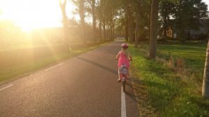 a girl riding a bike