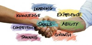 Through hard work and dedication, we have become what we are today – one of the best moving companies in NJ! Written skills and two people shaking hands.