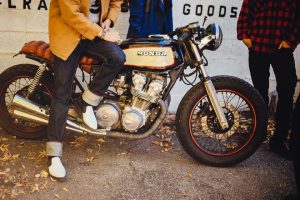 A man sitting on a motorcycle.