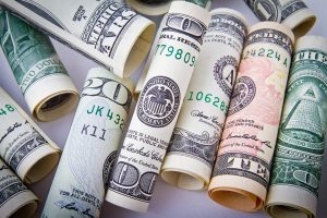 If you are short on cash, movers and packers will be out of the question. In that case, just follow our guide. Rolled up dollar bills.