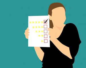 Test scores are a good means of determining whether a school is worthy of your attention. A woman looking at rankings when choosing the perfect school.