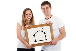 Choose wisely among properties to find the best house for yourself a couple holding a picture of a house