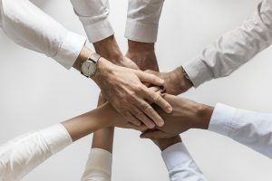 A group of people holding hands.