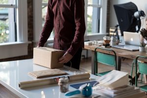 Man packing his belongings properly for keeping rodents out of storage units