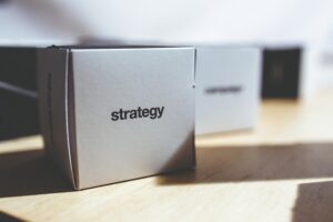 Box with strategy sign on it