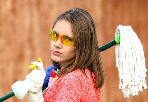 girl with mop part of expert cleaning services